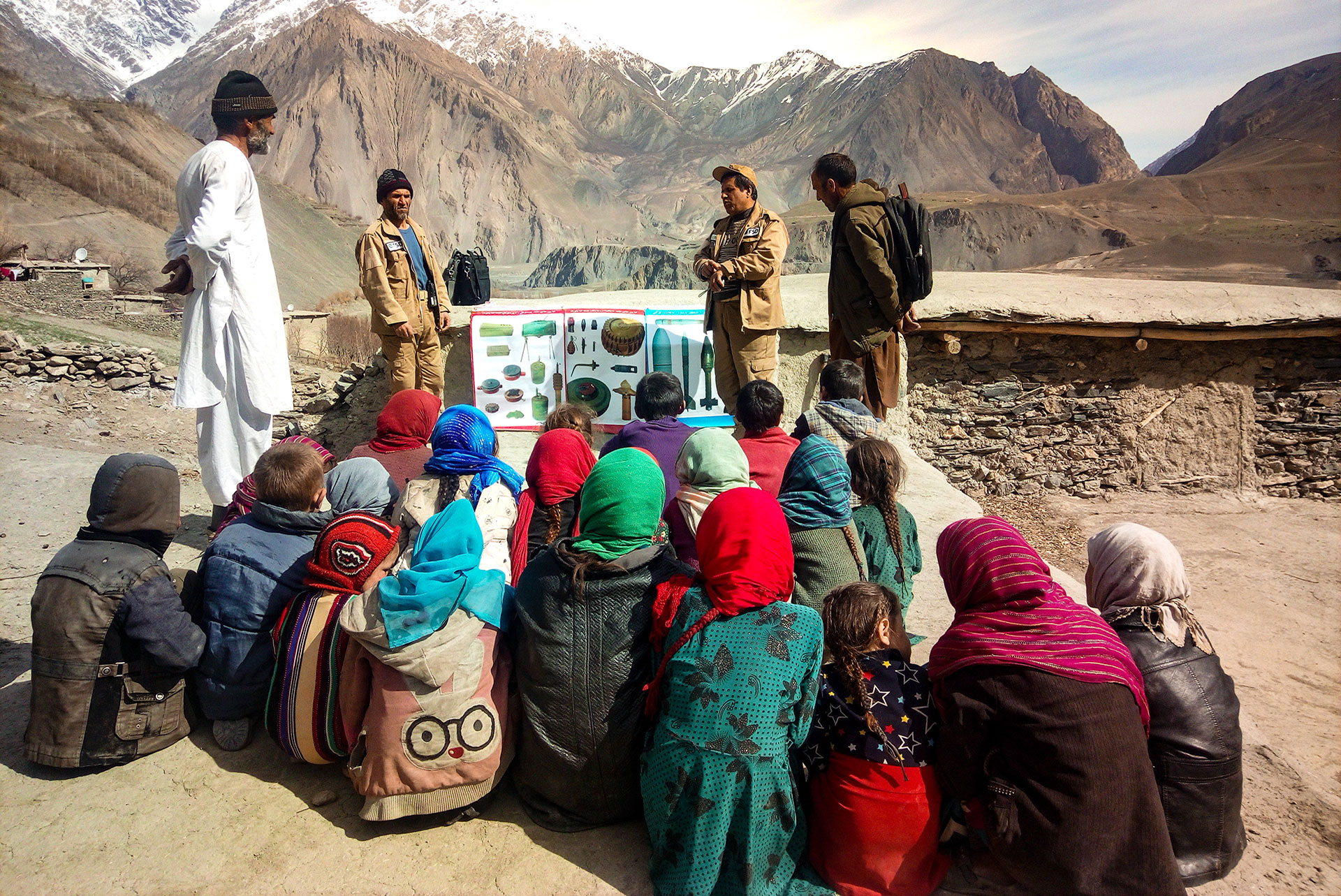 FSD employees and children in an EORE session in front of the mountains FSD employees and children in an EORE session in front of the mountains