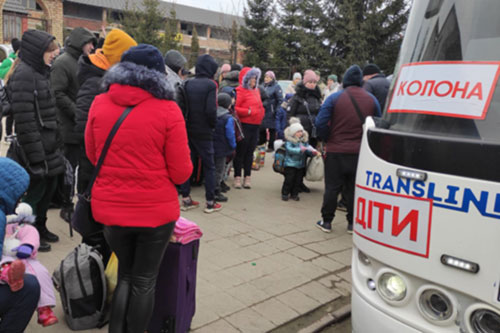 The lower red sign means “children” in the hope invaders spare the convoy