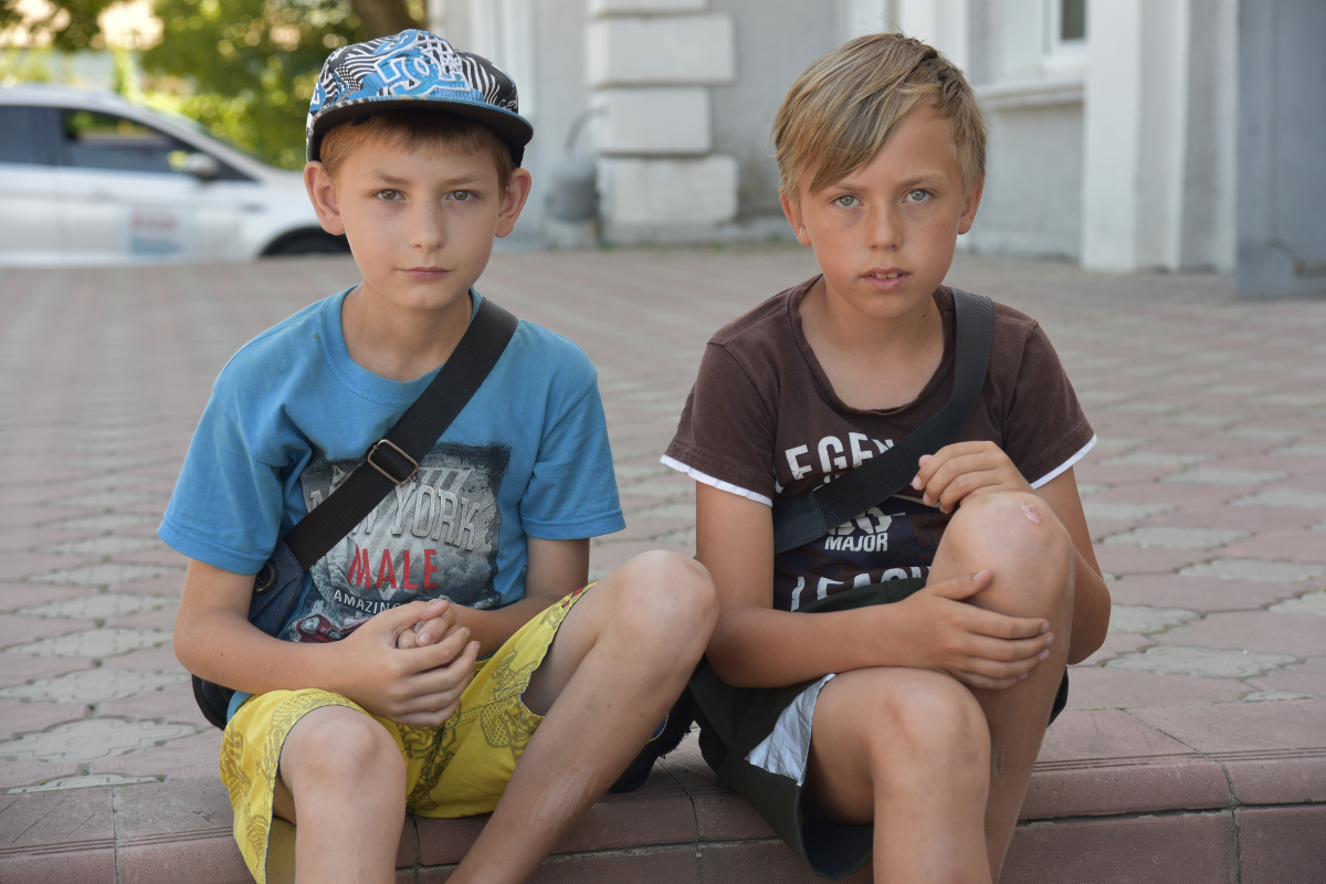 Two Ukrainian boys sitting
