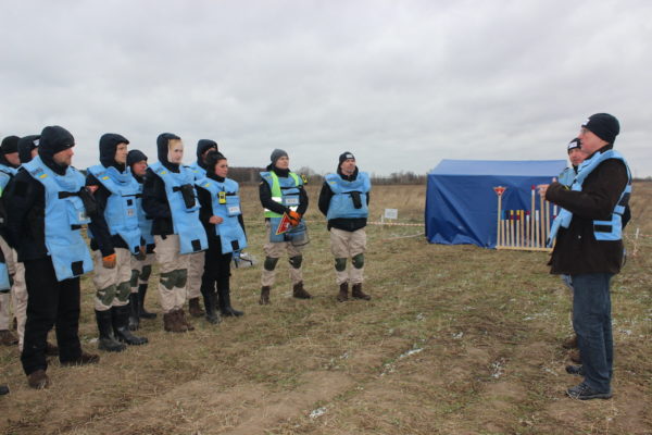 Morning briefing of a demining team in Chernihiv province, late March 2023